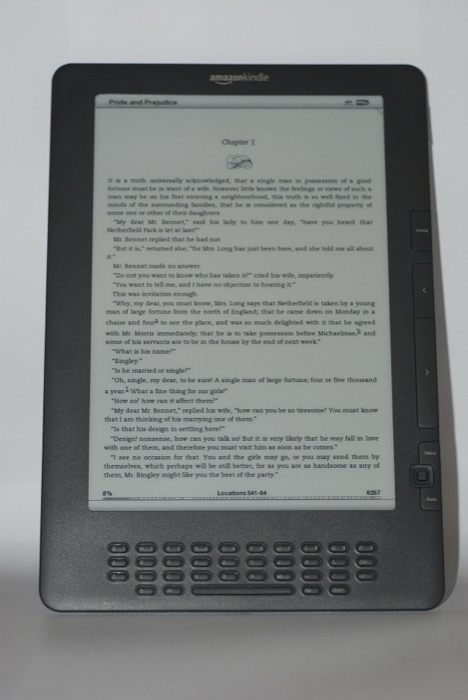 An older monochrome Kindle DX displaying a page of black-and-white text.
